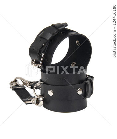 Toy black leather handcuffs isolated on the white background 124416180