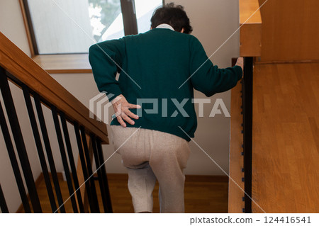 old man suffering from back pain 124416541