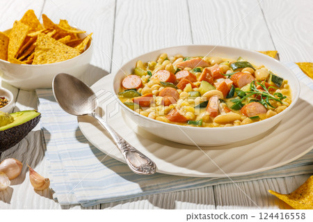 white bean chickpea chili with sausages, zucchini white bean chickpea chili with sausages, zucchini 124416558
