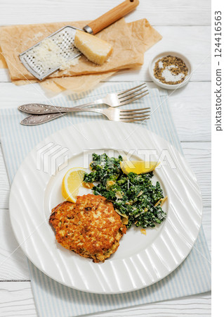 chicken patty with kale almond parmesan salad 124416563
