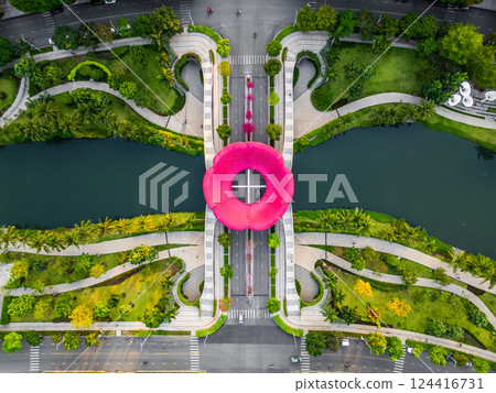 green urban tropical park with creative flower sculpture, Sala district, Ho Chi Minh city, aerial drone view 124416731