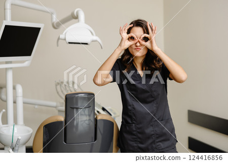Smiling female dentist looking at the camera in dental clinic 124416856