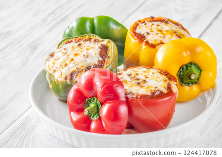 Juicy Baked Bell Peppers Stuffed with Flavorful Bolognese and Topped with Golden Mozzarella 124417078