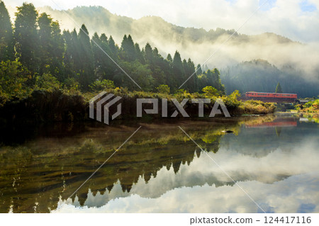 A diesel railcar on the Bantan Line crossing the Kamiichigawa Bridge with morning mist still lingering A diesel railcar on the Bantan Line crossing the Kamiichigawa Bridge with morning mist still lingering 124417116
