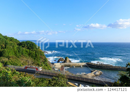 Sanriku Railway diesel railcar crossing the Osawa Bridge with the Pacific Ocean in the background Sanriku Railway diesel railcar crossing the Osawa Bridge with the Pacific Ocean in the background 124417121