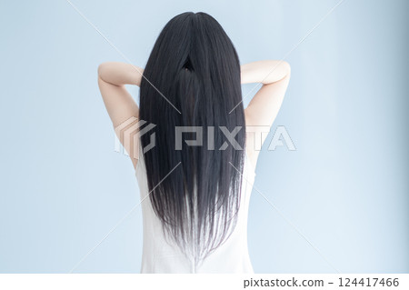 Back view of a beautiful woman with long hair Back view of a beautiful woman with long hair 124417466
