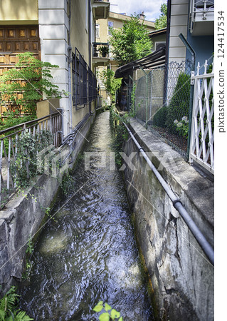 Water flowing in the canals of Merano, South Tyrol, Italy 124417534
