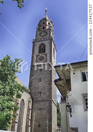 Clocktower of St. Nicholas Church, iconic landmark in Merano, Italy Clocktower of St. Nicholas Church, iconic landmark in Merano, Italy 124417537