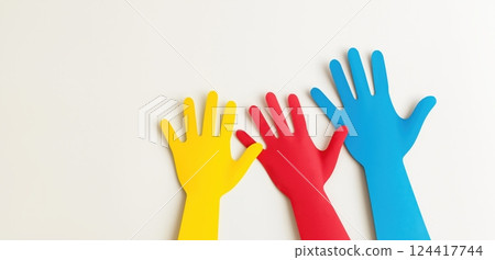 Three colorful hands symbolizing unity and diversity 124417744