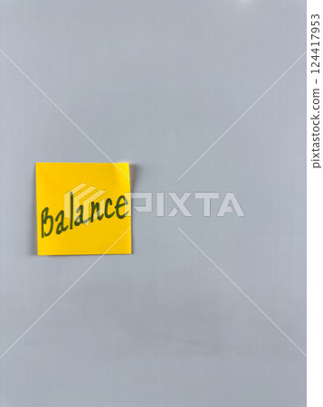 Sticky note with the word Balance written on it, affixed to white background. Illustrating themes of balance, harmony, and stability in personal and professional life. Great for concept creation Sticky note with the word Balance written on it, affixed to white background. Illustrating themes of balance, harmony, and stability in personal and professional life. Great for concept creation 124417953