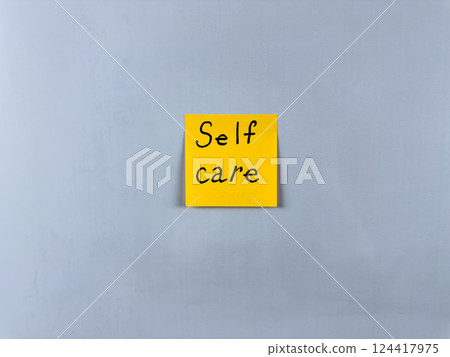 Sticky note with the words Self Care written on it, pinned on white background. Photo symbolizes well being, self love, and health. Perfect for illustrating concepts of self care and personal wellness Sticky note with the words Self Care written on it, pinned on white background. Photo symbolizes well being, self love, and health. Perfect for illustrating concepts of self care and personal wellness 124417975