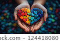 Hands Holding Autism Puzzle Heart  124418080