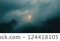 Glowing Cross Emerging from Mystical Fog  124418105