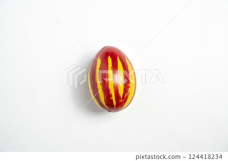 Top view of a colorful decorated easter egg isolated over a white background. Concept of celebrating the easter holiday Top view of a colorful decorated easter egg isolated over a white background. Concept of celebrating the easter holiday 124418234