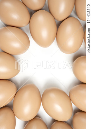 Top view of easter eggs on a white background. Copy space. Concept of celebrating the easter holiday Top view of easter eggs on a white background. Copy space. Concept of celebrating the easter holiday 124418240