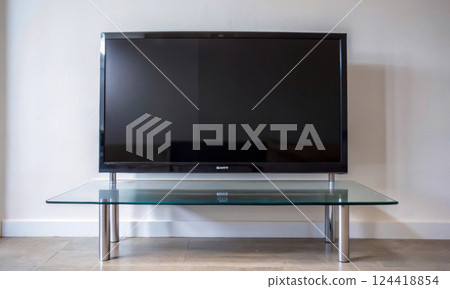 Aesthetics and technology: a TV in a bright interior with a minimalist design Aesthetics and technology: a TV in a bright interior with a minimalist design 124418854