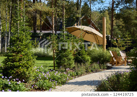 A Serene Garden Retreat featuring a charming Pathway and a comfortable Sun Umbrella A Serene Garden Retreat featuring a charming Pathway and a comfortable Sun Umbrella 124419725