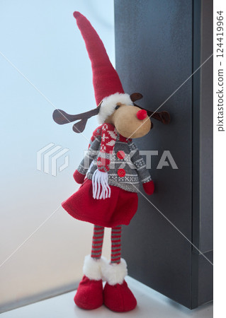 A delightful Festive Reindeer Doll adorned with a cozy Christmas Sweater and charming Hat A delightful Festive Reindeer Doll adorned with a cozy Christmas Sweater and charming Hat 124419964