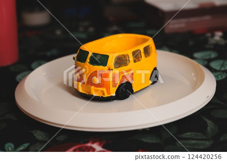 A cheerful Yellow Van Cake beautifully presented on a delightful Plate, ready to impress A cheerful Yellow Van Cake beautifully presented on a delightful Plate, ready to impress 124420256