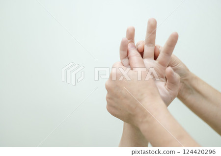 Close-up of female hands during massage. Close-up of female hands during massage. 124420296