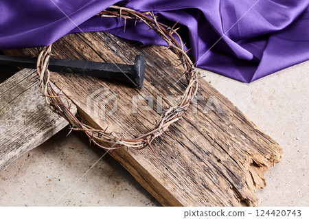 Easter background depicting the crucifixion with a rustic wooden cross, crown of thorns and nails. Easter background depicting the crucifixion with a rustic wooden cross, crown of thorns and nails. 124420743
