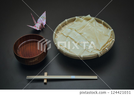 Boiled and served in a colander, wide Oni Himokawa udon noodles Boiled and served in a colander, wide Oni Himokawa udon noodles 124421031