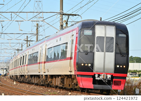 Meitetsu 2200 series express train running smoothly under clear autumn skies towards Chubu Centrair International Airport 124421972