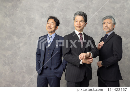 Group of smiling middle-aged male business people Group of smiling middle-aged male business people 124422567