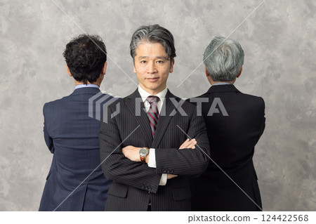 Group of smiling middle-aged male business people Group of smiling middle-aged male business people 124422568