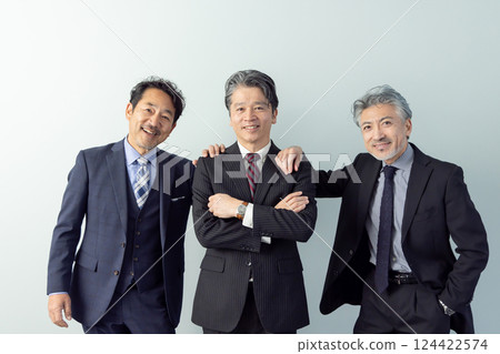 Group of smiling middle-aged male business people Group of smiling middle-aged male business people 124422574