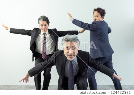 A middle-aged male business person in high spirits A middle-aged male business person in high spirits 124422581