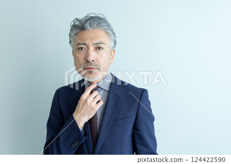Middle-aged male business person Middle-aged male business person 124422590