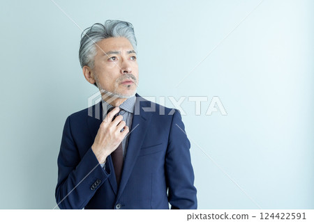 Middle-aged male business person 124422591