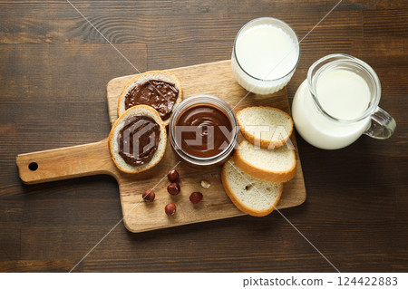Morning food concept - tasty bread with chocolate pasta Morning food concept - tasty bread with chocolate pasta 124422883