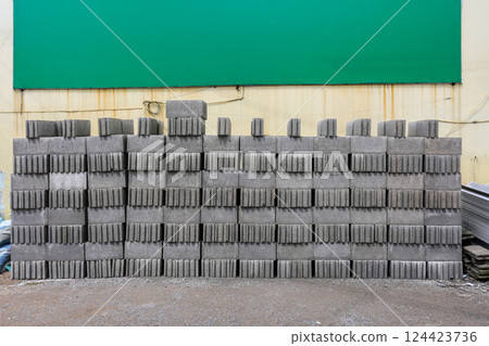 A stack of gray cement blocks at warehouse. A stack of gray cement blocks at warehouse. 124423736