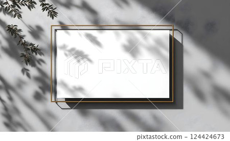 An Elegant Framed Blank Canvas That Displays Artistic Shadows and Creative Ambiance 124424673