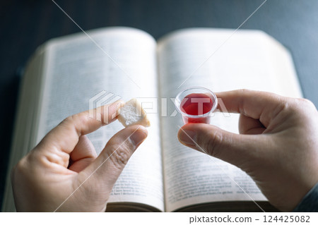 Holy Communion or Eucharist of christianity concept. Eucharist is sacrament instituted by Jesus. during last supper with disciples. Bread and wine is body and blood of Jesus Christ of Christians. Holy Communion or Eucharist of christianity concept. Eucharist is sacrament instituted by Jesus. during last supper with disciples. Bread and wine is body and blood of Jesus Christ of Christians. 124425082