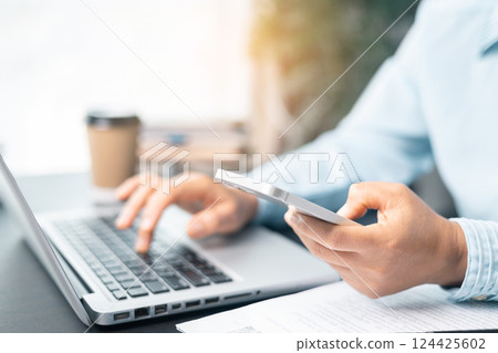 Business woman working on documents looking concentrated with briefcase on table. Businesswoman is deeply reviewing a financial report for a return on investment or investment risk analysis. 124425602
