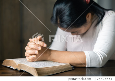Woman pray for god blessing to wishing have better life. Female hands worship to god. Woman hands praying to god. Christian life crisis prayer to god. begging for forgiveness and believe in goodness. 124425634