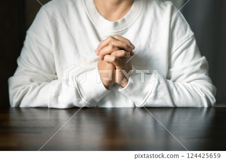 Woman hands praying to god. Christian life crisis prayer to god. Woman pray for god blessing to wishing have better life. Female hands worship to god. begging for forgiveness and believe in goodness. 124425659