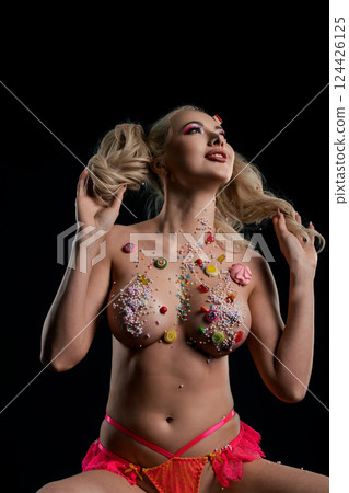 Woman showcasing vibrant body art with unique designs and embellishments Woman showcasing vibrant body art with unique designs and embellishments 124426125