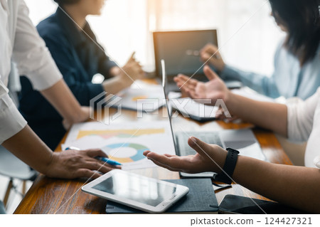 Corporate office meeting, professional businessman led the group of employees, emphasizing the importance of teamwork and collaboration in achieving business success. Group business meeting concept. Corporate office meeting, professional businessman led the group of employees, emphasizing the importance of teamwork and collaboration in achieving business success. Group business meeting concept. 124427321