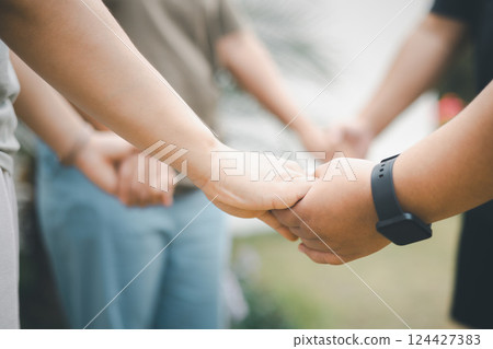 Diverse group came together to pray, support, and help each other, showcasing the strength of community through their diverse backgrounds and unified hands. Group Christian pray concept. 124427383