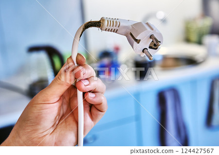 Poor contact between socket and plug led to power cord burning and almost caused fire. Poor contact between socket and plug led to power cord burning and almost caused fire. 124427567