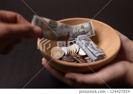 Realm of finance and business, it's crucial to save money wisely, spend cash judiciously and give helping hand through donations for financial stability and social impact. save, give, spend, money. 124427854