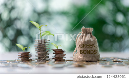 Green bonds and ESG investments, businesses recognize potential to positively impact economy and nature, against background of evolving market prices and rise of sustainable finance valuable coin. Green bonds and ESG investments, businesses recognize potential to positively impact economy and nature, against background of evolving market prices and rise of sustainable finance valuable coin. 124428061