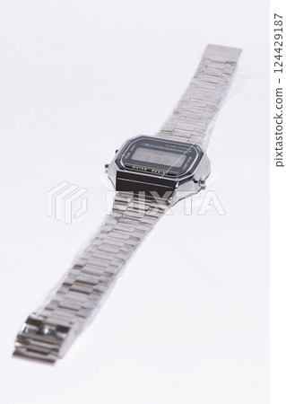 Silver watch with electronic dial on white background. Silver watch with electronic dial on white background. 124429187