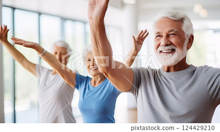 Workout with group during yoga session. Sporty elder people working out in class. Active lifestyle concept. 124429210