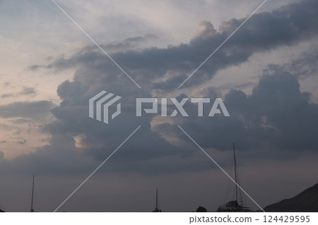 A Dramatic and Mesmerizing Evening Sky Filled with Clouds and Beautiful Silhouettes 124429595