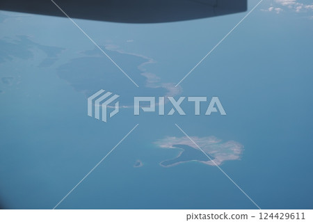 Stunning Scenic Aerial View of Beautiful Remote Islands Surrounded by a Blue Ocean 124429611